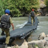 Rescue Bridge training - deployed across a river to reach the other side