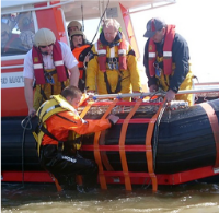 Fibrelight Recovery Cradle Climibg aboard the side of a baot