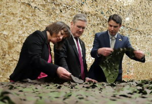 Labours Kier Starmer and Jo Stevens examine camo nets at BCB International, Cardiff.